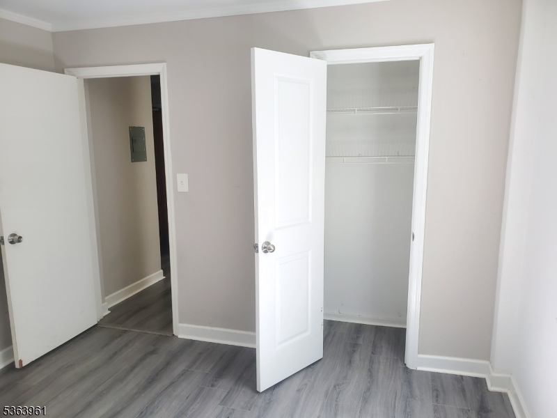 935 East Front Street Plainfield, NJ 07062 - Photo 24 of 25 a view of an empty room with wooden floor