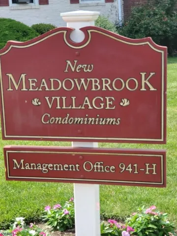 a sign that is sitting on a wall