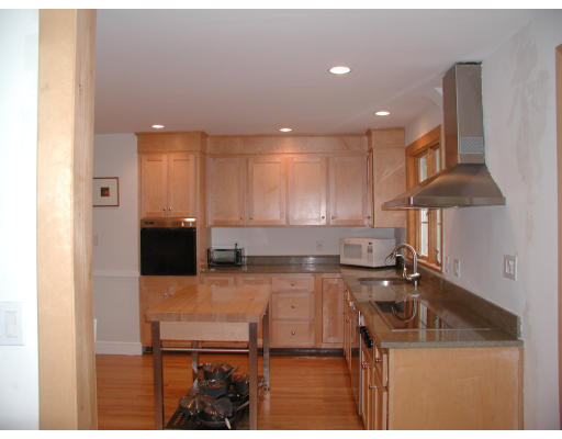 23 Roberts Road Wellesley, MA 02481 - Photo 3 of 7 a kitchen with a sink a stove and cabinets