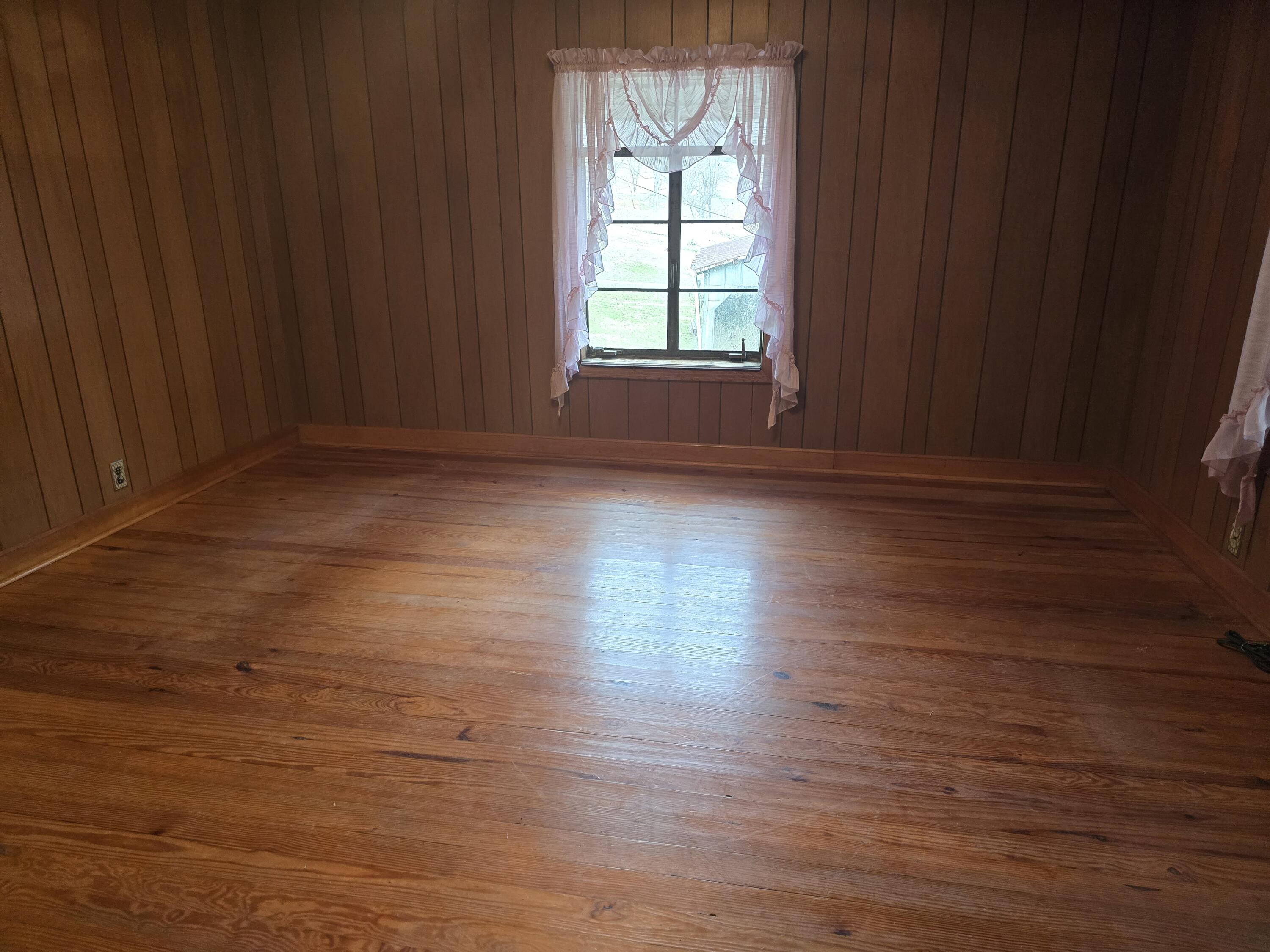 1685 Davis Buchanan, VA 24066 - Photo 4 of 12 an empty room with wooden floor and windows