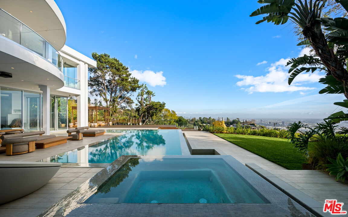 1609 Magnetic Terrace Los Angeles, CA 90069 - Photo 17 of 24 a view of a swimming pool with an outdoor seating