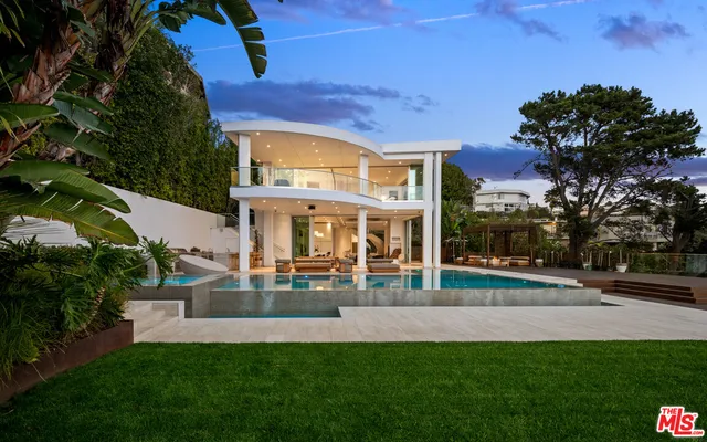 a view of a building with a yard