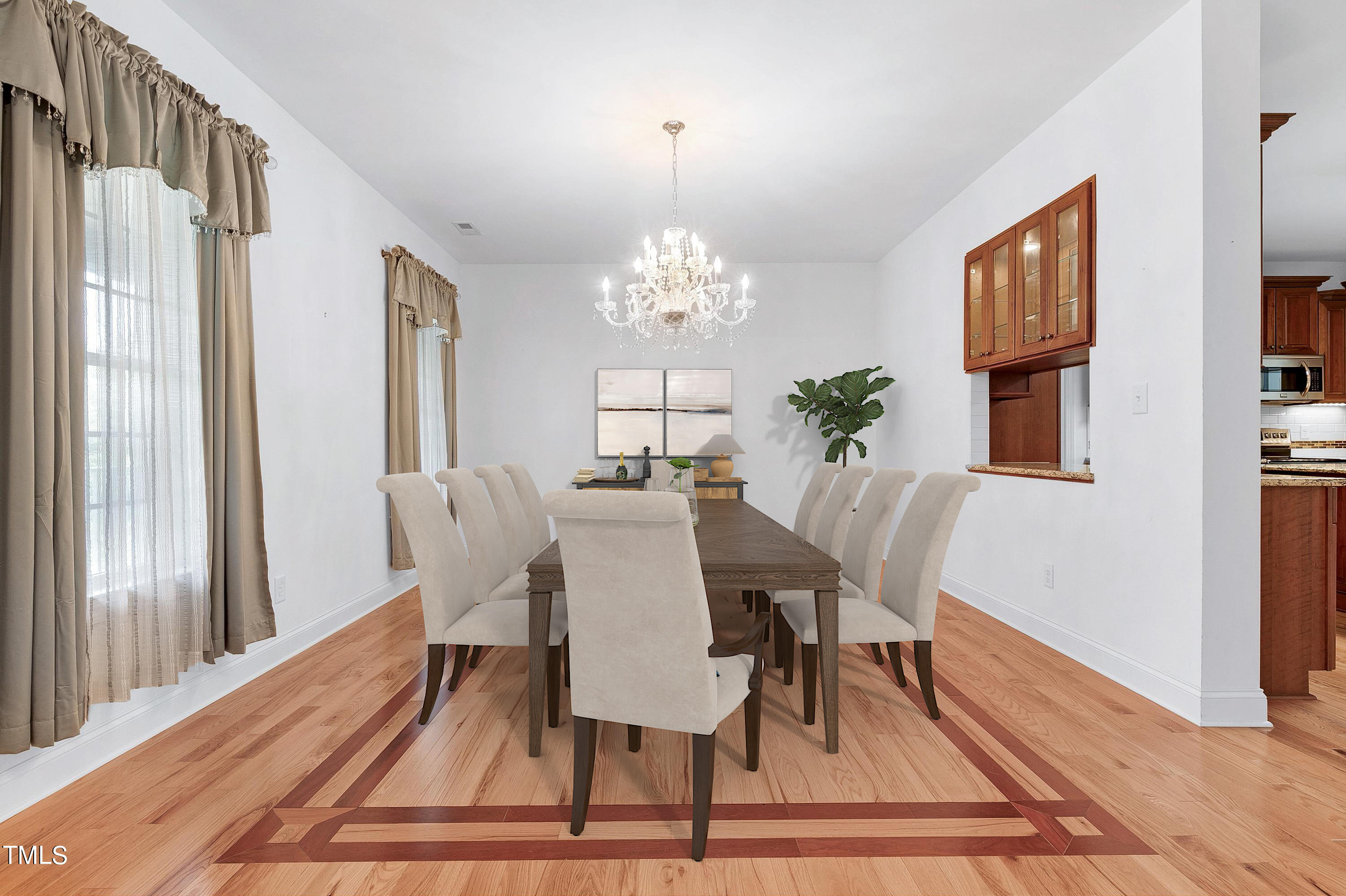 644 Uwharrie Ridge Road Chapel Hill, NC 27516 - Photo 13 of 43 a view of a dining room with furniture window and wooden floor