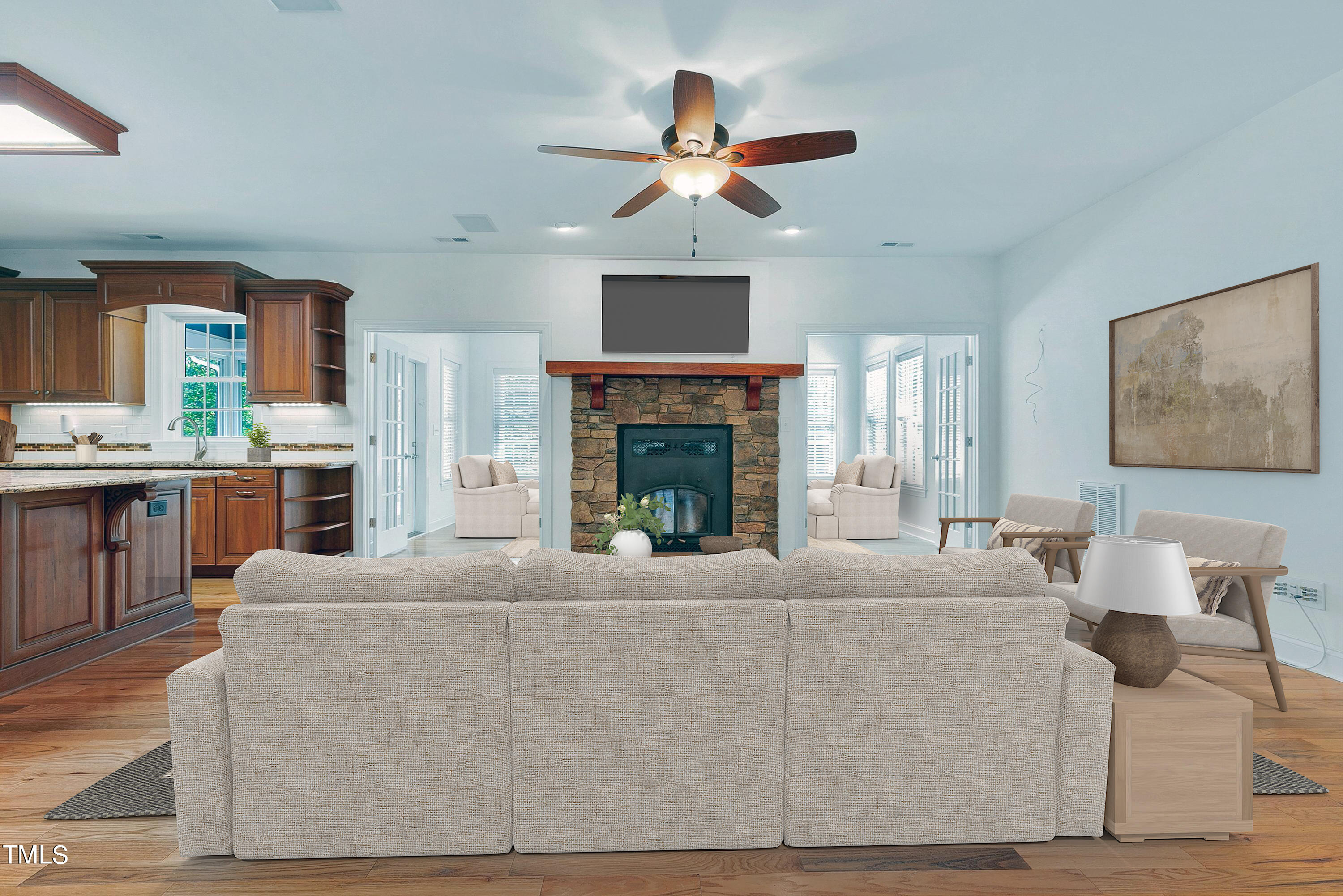 644 Uwharrie Ridge Road Chapel Hill, NC 27516 - Photo 15 of 43 a living room with furniture a fireplace and a ceiling fan