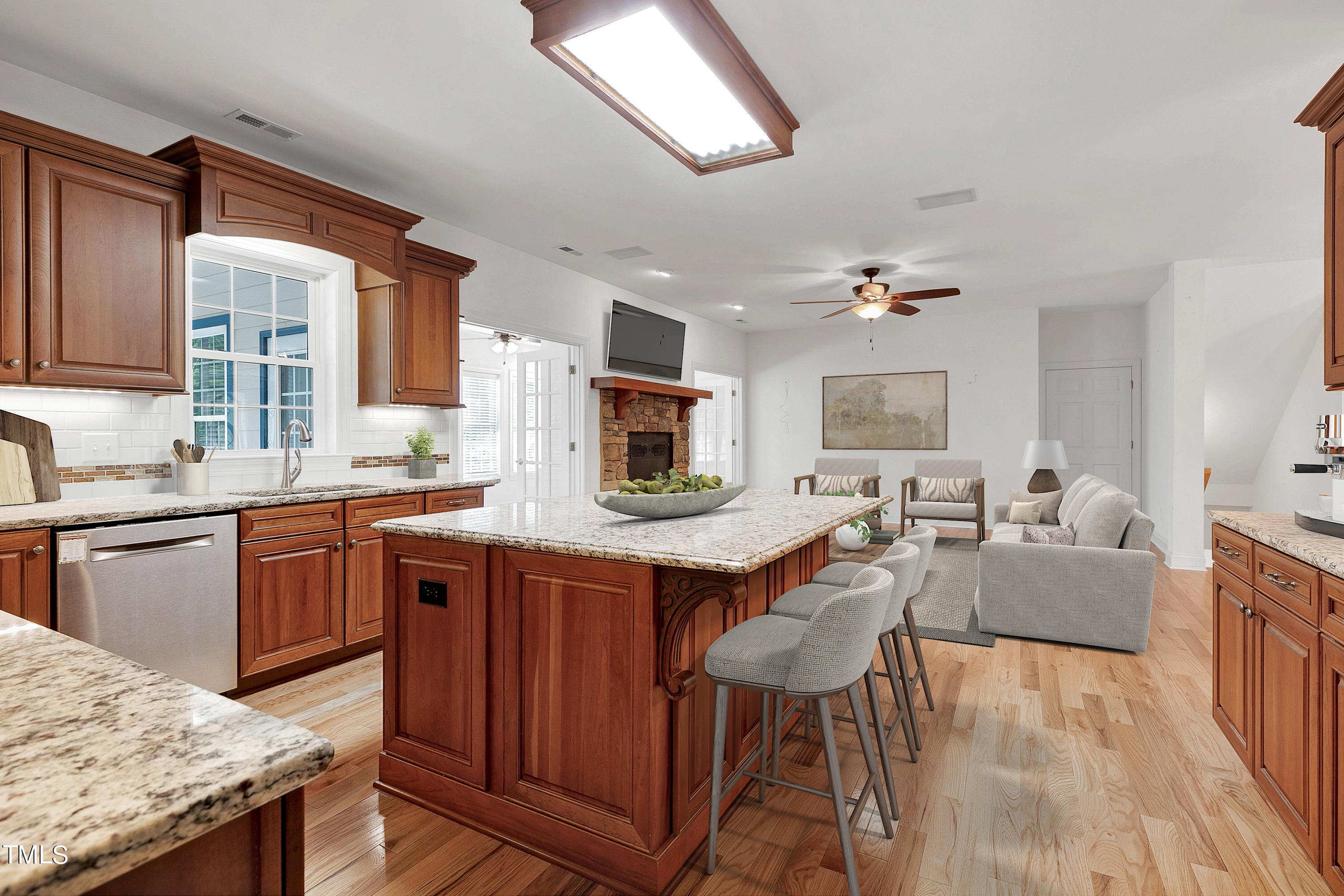 644 Uwharrie Ridge Road Chapel Hill, NC 27516 - Photo 18 of 43 a kitchen with granite countertop lots of counter top space and wooden floor