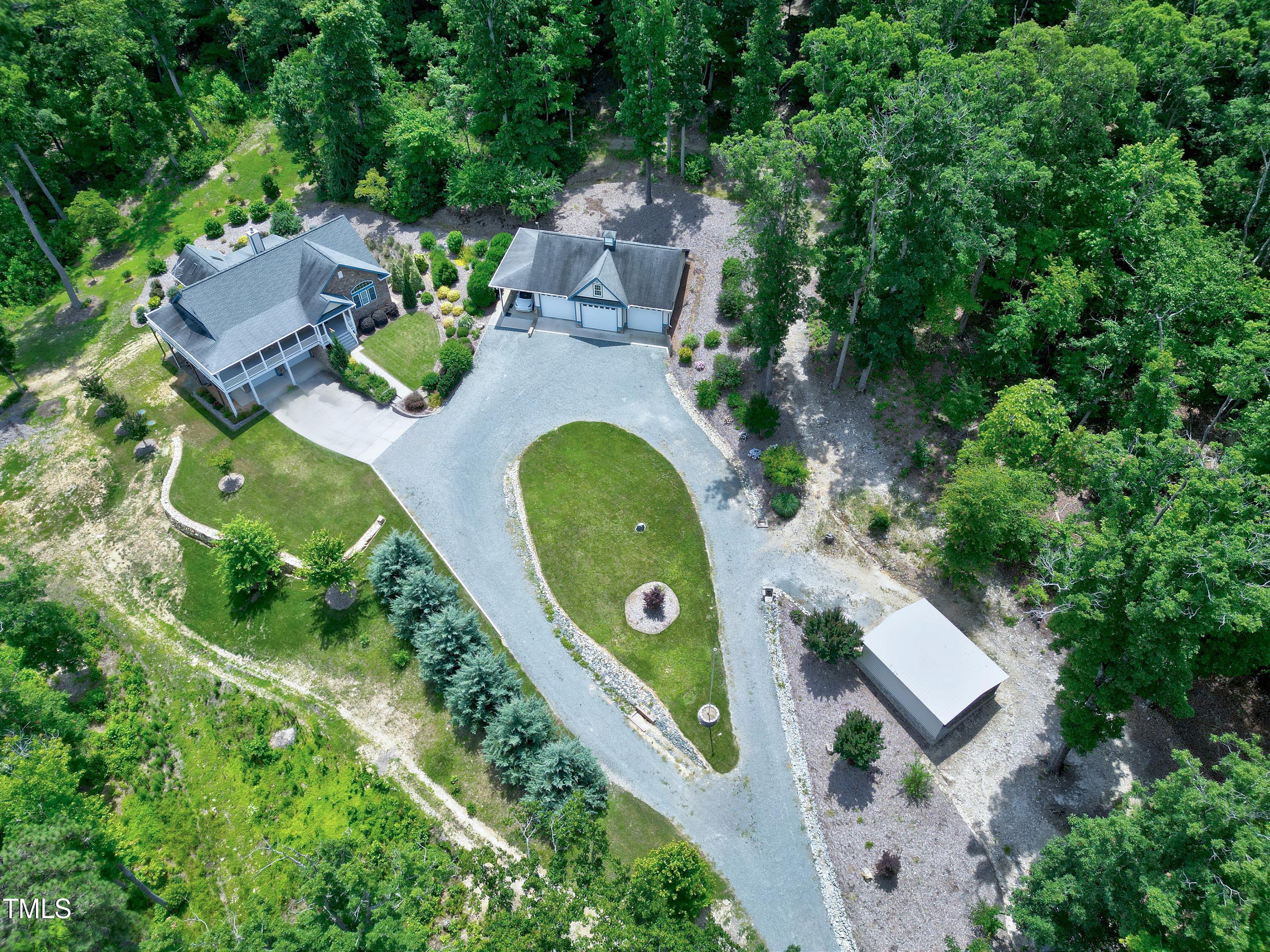 644 Uwharrie Ridge Road Chapel Hill, NC 27516 - Photo 2 of 43 an aerial view of a house with outdoor space