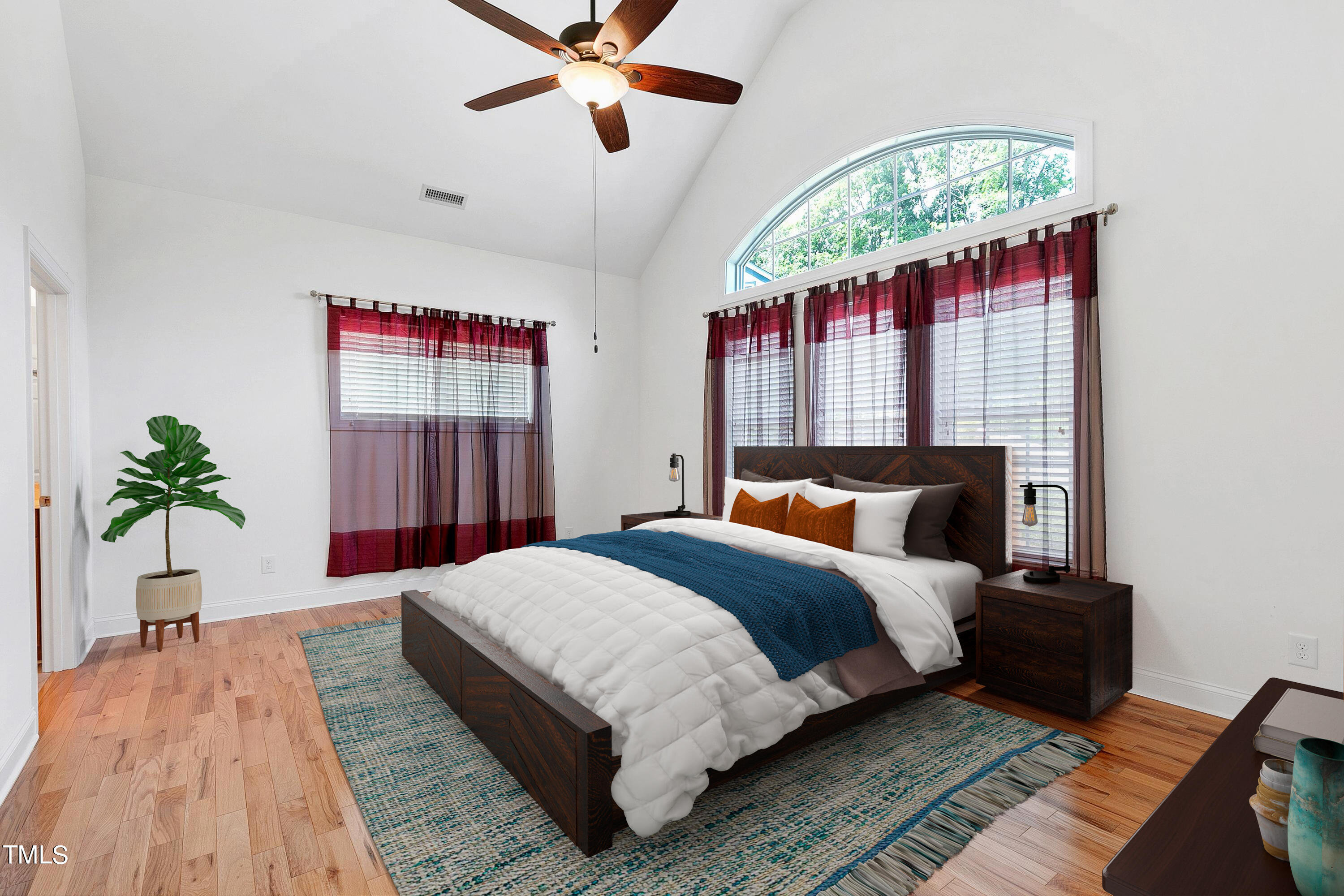 644 Uwharrie Ridge Road Chapel Hill, NC 27516 - Photo 23 of 43 a bedroom with a large bed and a chandelier