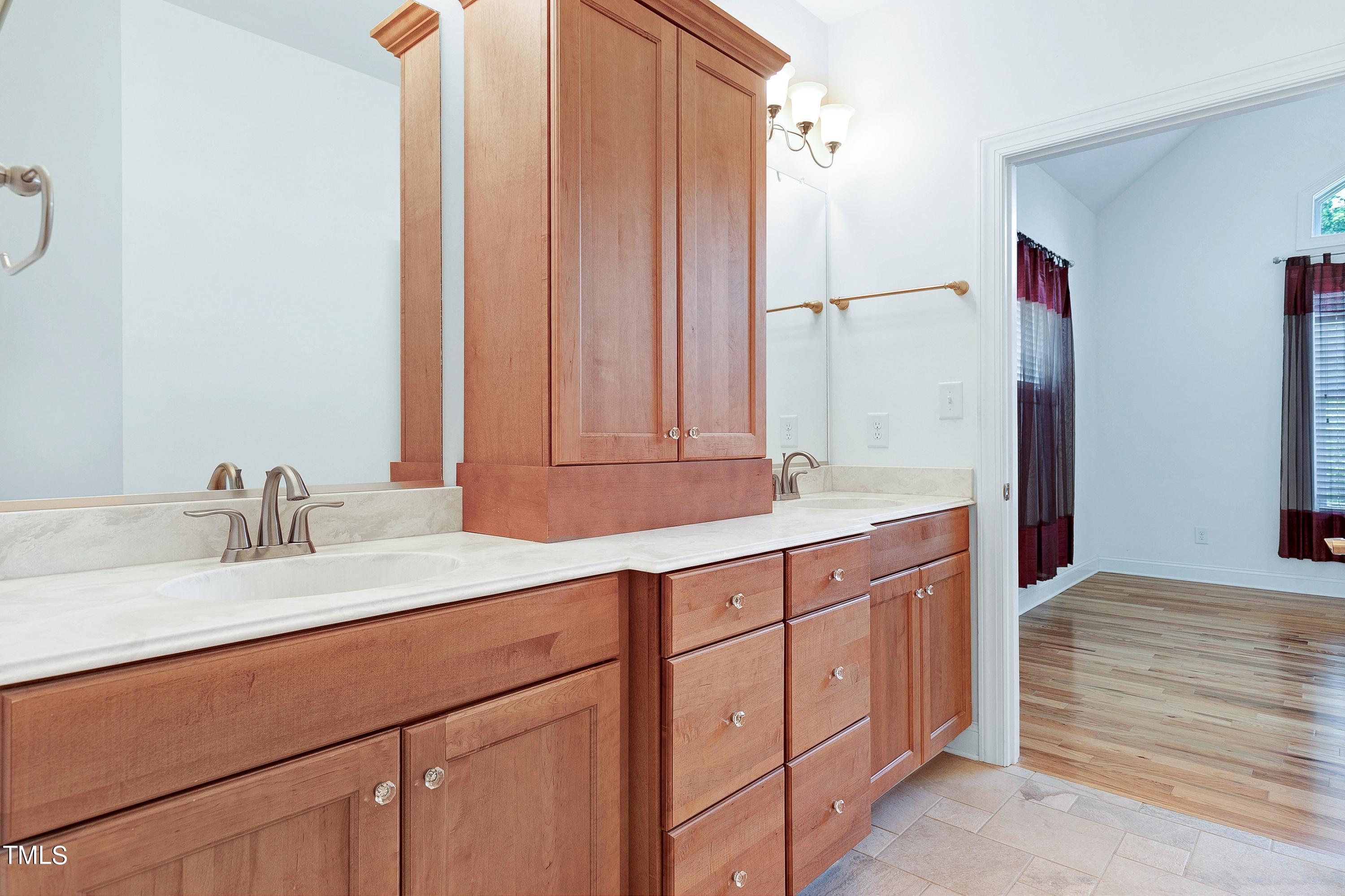 644 Uwharrie Ridge Road Chapel Hill, NC 27516 - Photo 25 of 43 a bathroom with a sink and a mirror