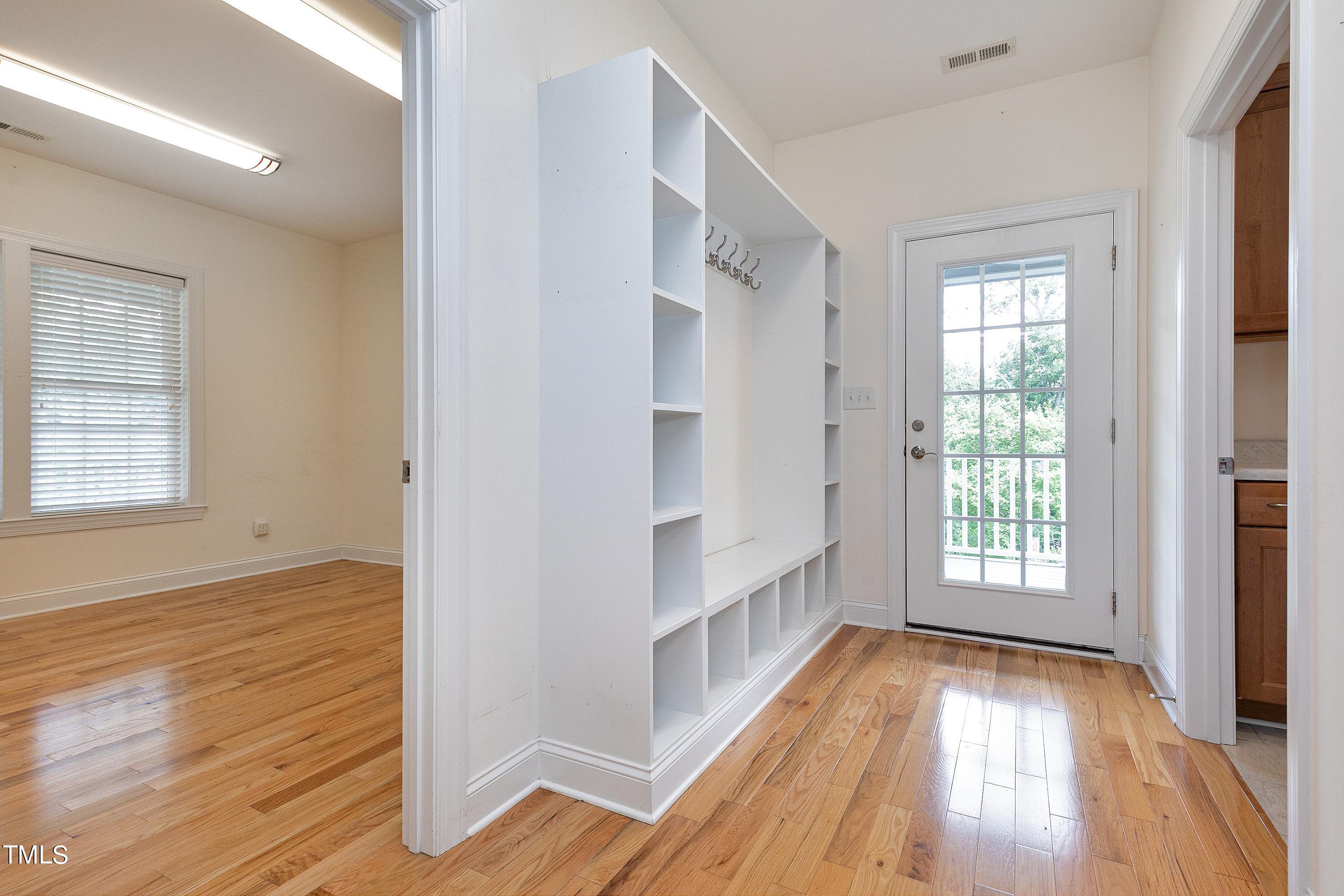 644 Uwharrie Ridge Road Chapel Hill, NC 27516 - Photo 27 of 43 a view of an empty room with wooden floor and a window