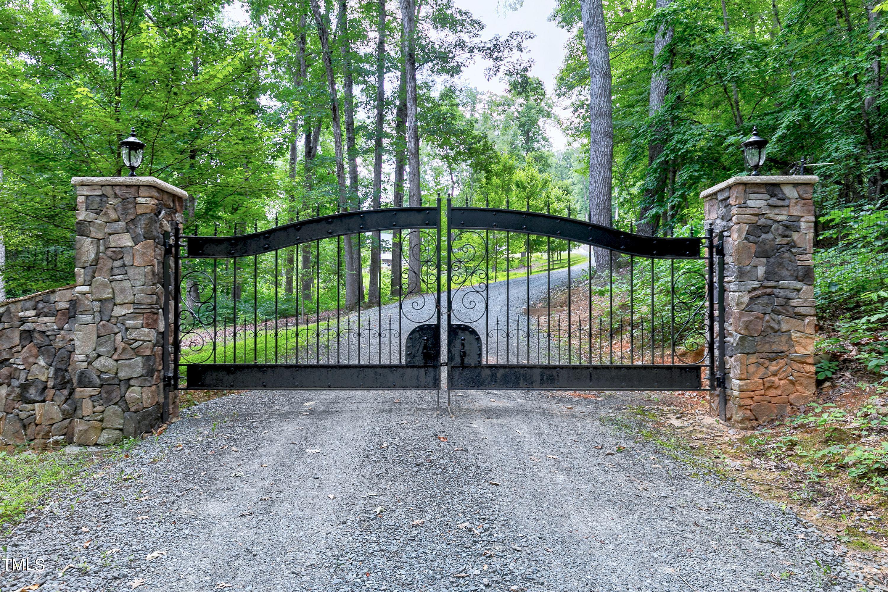 644 Uwharrie Ridge Road Chapel Hill, NC 27516 - Photo 42 of 43 a view of a backyard with a small fence