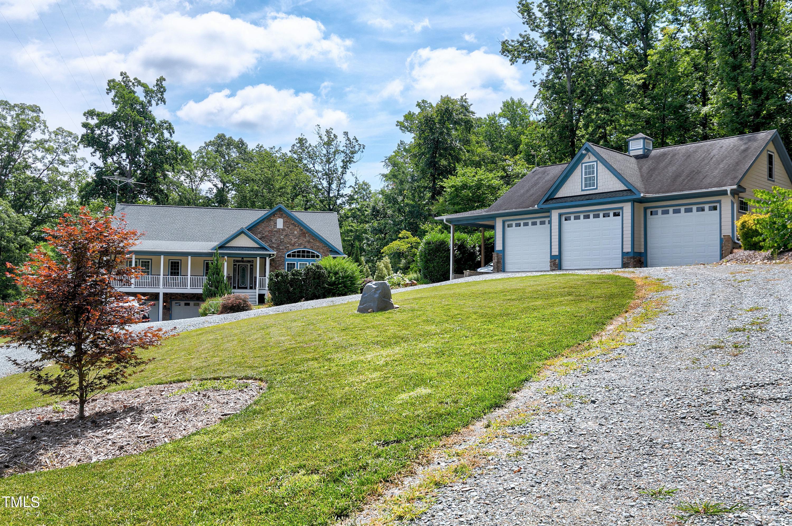 644 Uwharrie Ridge Road Chapel Hill, NC 27516 - Photo 10 of 43 a front view of a house with a garden
