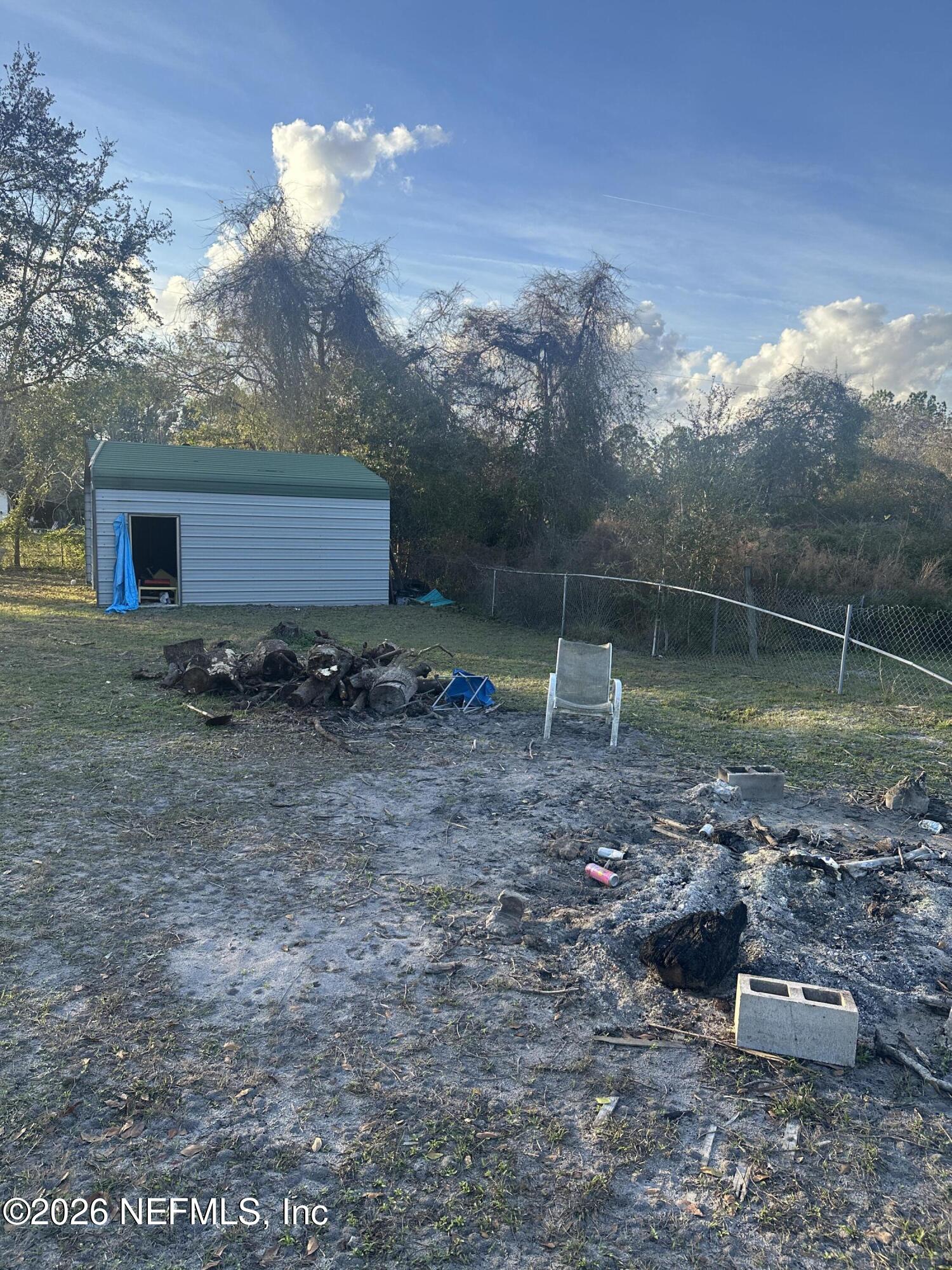 10269 Grayson Street Jacksonville, FL 32220 - Photo 3 of 9 a backyard of a house with lots of green space