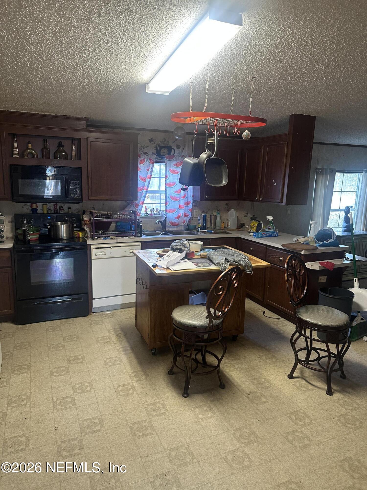 10269 Grayson Street Jacksonville, FL 32220 - Photo 9 of 9 a room with furniture pool table and chairs