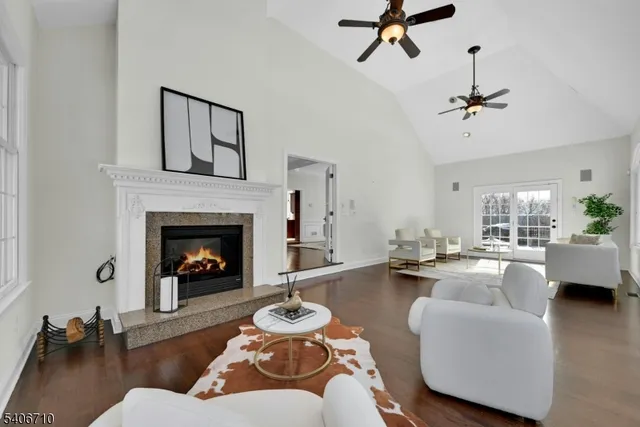 a living room with a couch and wooden floor