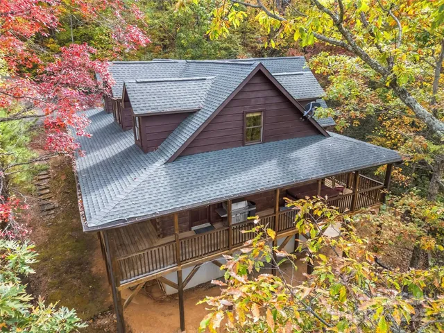 a view of house with wooden fence
