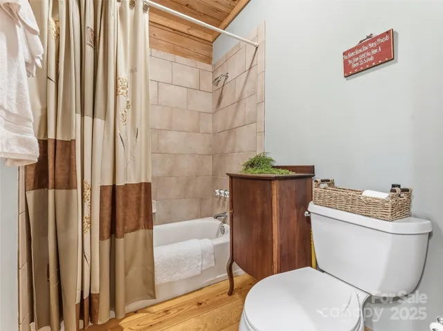 a bed room with furniture and a large window