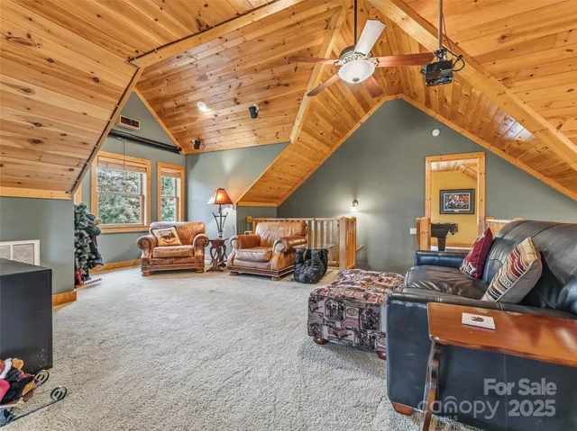 a room with pool table and windows