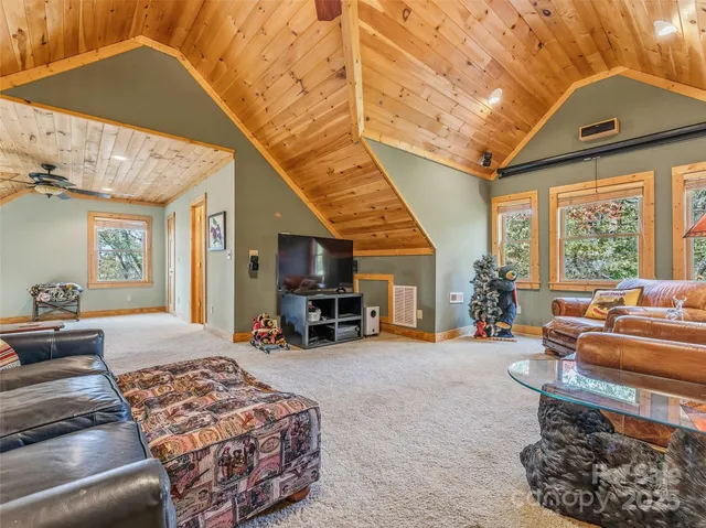 a room with pool table and windows