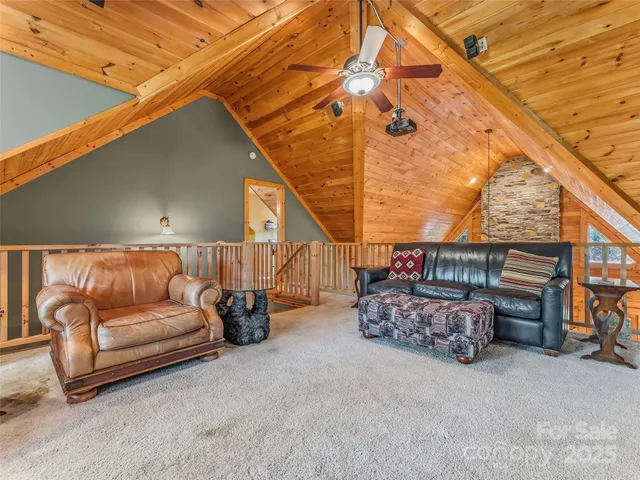a room with furniture pool table and windows