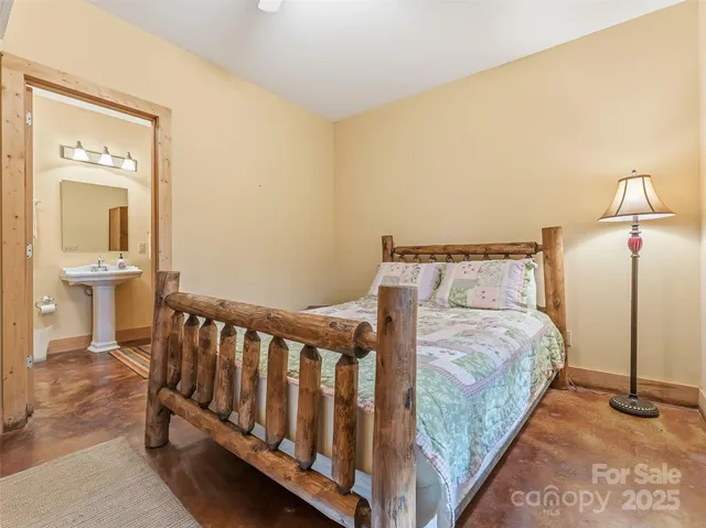 a living room with furniture a flat screen tv and a table