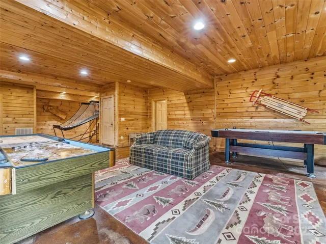 a bathroom with a sink toilet a mirror and shower