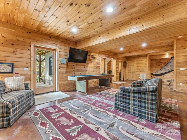 a bedroom with two beds and a desk