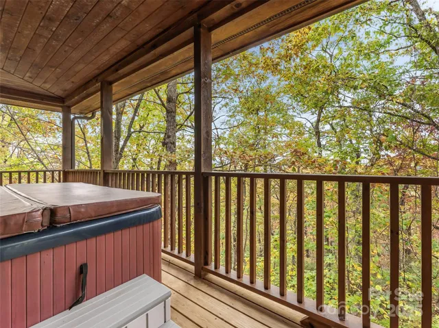 a living room with fireplace furniture and a large window