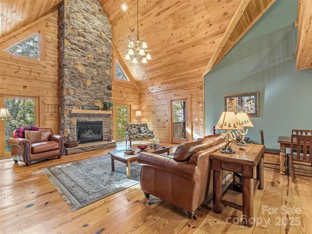 a view of entryway livingroom and hall with wooden floor