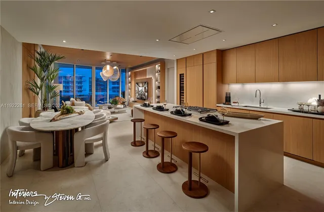 a kitchen with a sink appliances and cabinets