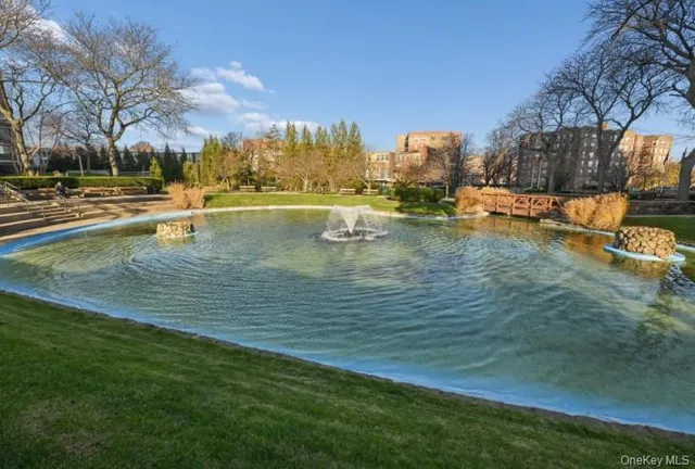 a view of yard with swimming pool and outdoor seating