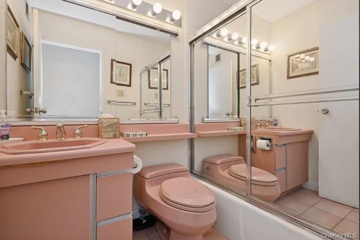 1 Bay Club Drive, Unit 6V Queens, NY 11360 - Photo 11 of 21 a bathroom with a sink a toilet and mirror