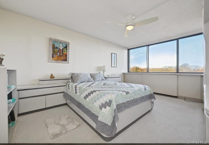 1 Bay Club Drive, Unit 6V Queens, NY 11360 - Photo 12 of 21 a spacious bedroom with a bed and window