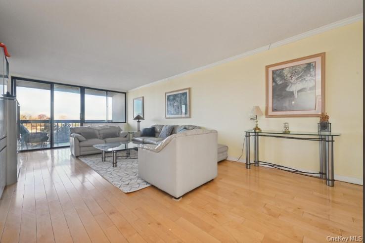 1 Bay Club Drive, Unit 6V Queens, NY 11360 - Photo 4 of 21 a living room with furniture and a large window