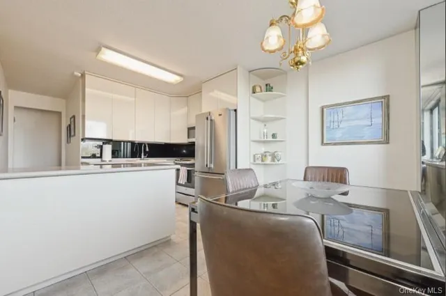 a kitchen with cabinets a sink and appliances