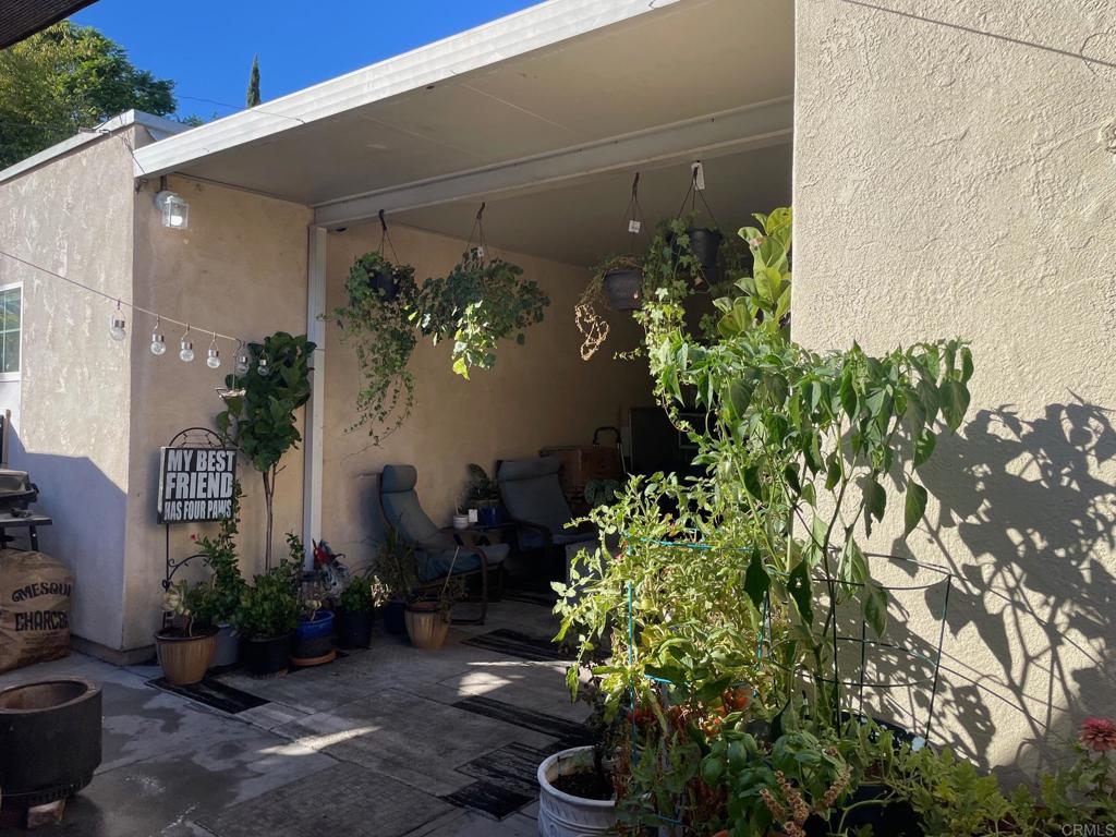 a vase with flowers sitting on a floor