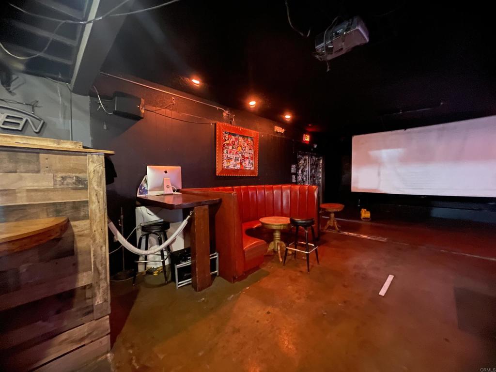 9141-43 Campo Road Spring Valley, CA 91977 - Photo 5 of 26 a room with furniture and a flat screen tv