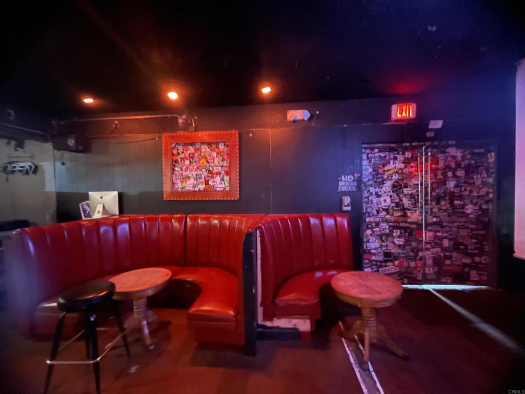 9141-43 Campo Road Spring Valley, CA 91977 - Photo 7 of 26 a blue room with furniture and wooden floor