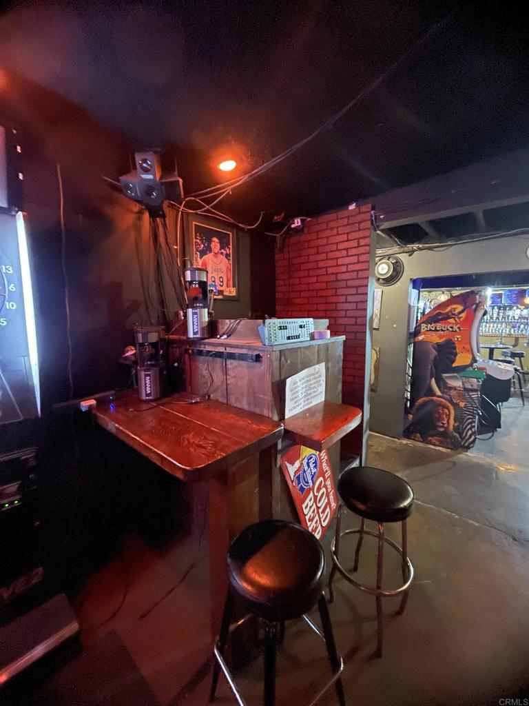 9141-43 Campo Road Spring Valley, CA 91977 - Photo 8 of 26 a patio with table and chairs with plants