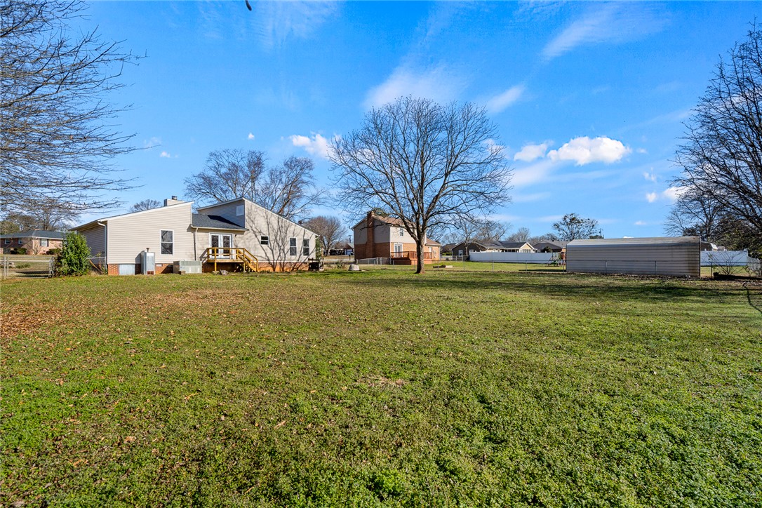 2305 Millgate Road Anderson, SC 29621 - Photo 18 of 18 A spacious backyard provides ample green space for outdoor activities and relaxation.