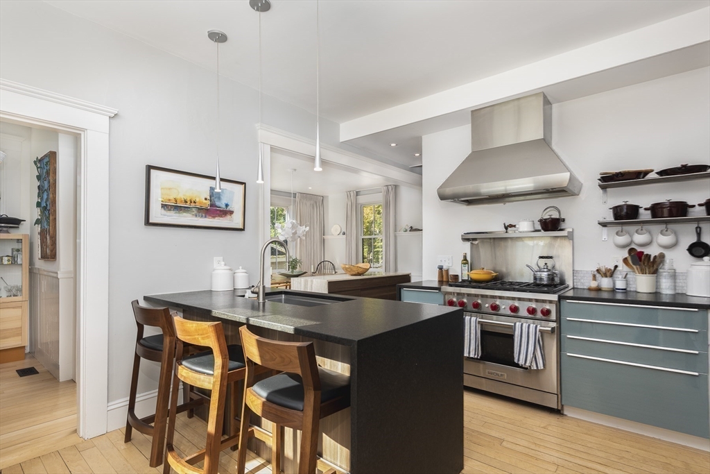4 Ballast Lane Marblehead, MA 01945 - Photo 11 of 42 a kitchen with stainless steel appliances granite countertop a stove and a sink