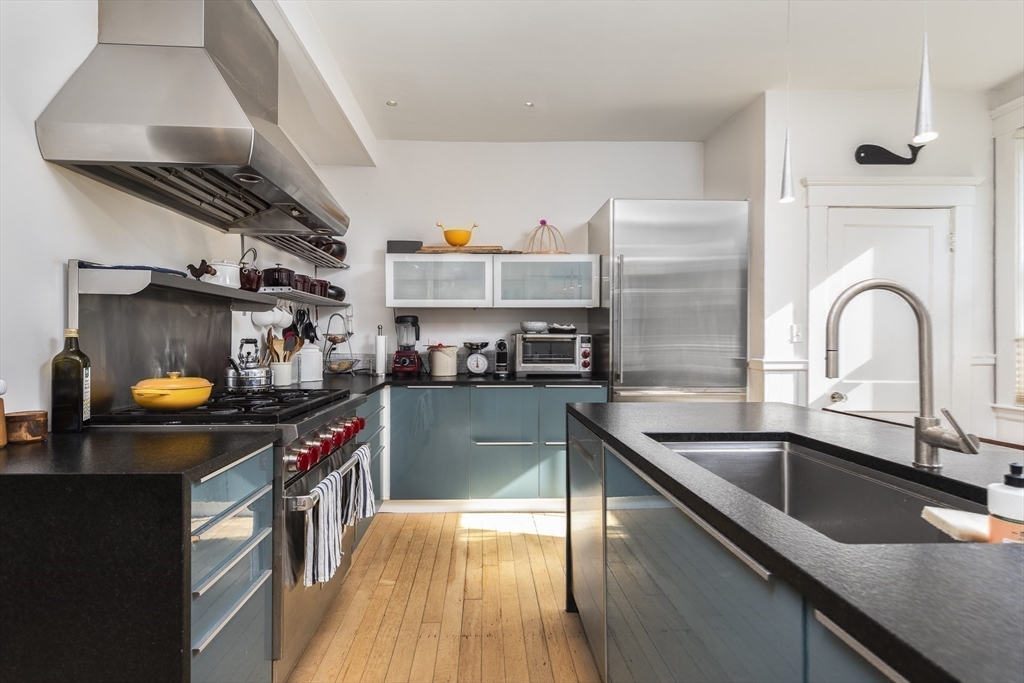 4 Ballast Lane Marblehead, MA 01945 - Photo 12 of 42 a kitchen that has a sink and a stove