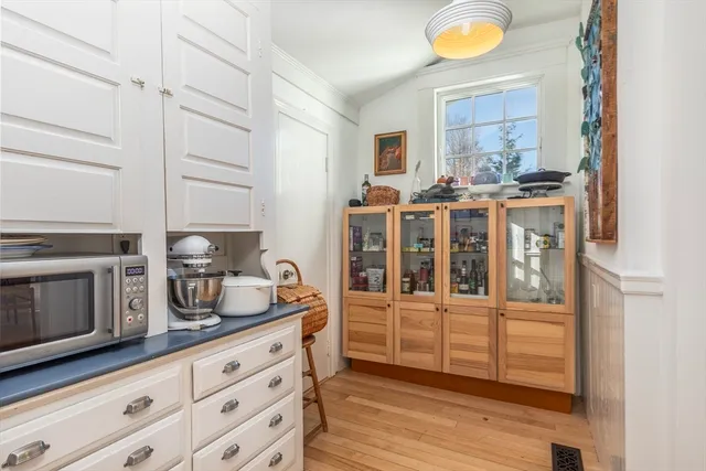 a kitchen with stainless steel appliances kitchen island granite countertop a sink and cabinets