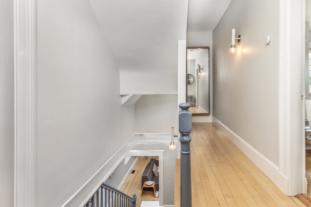4 Ballast Lane Marblehead, MA 01945 - Photo 19 of 42 a view of a hallway with wooden floor and staircase