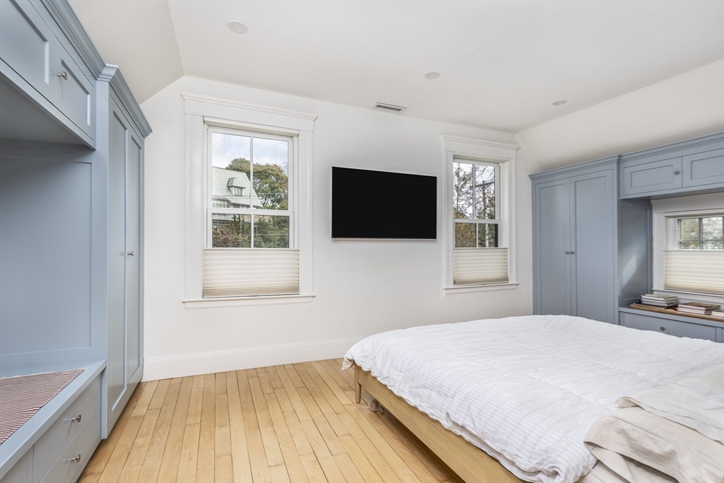 4 Ballast Lane Marblehead, MA 01945 - Photo 20 of 42 a bedroom with a bed and a flat tv screen on dresser