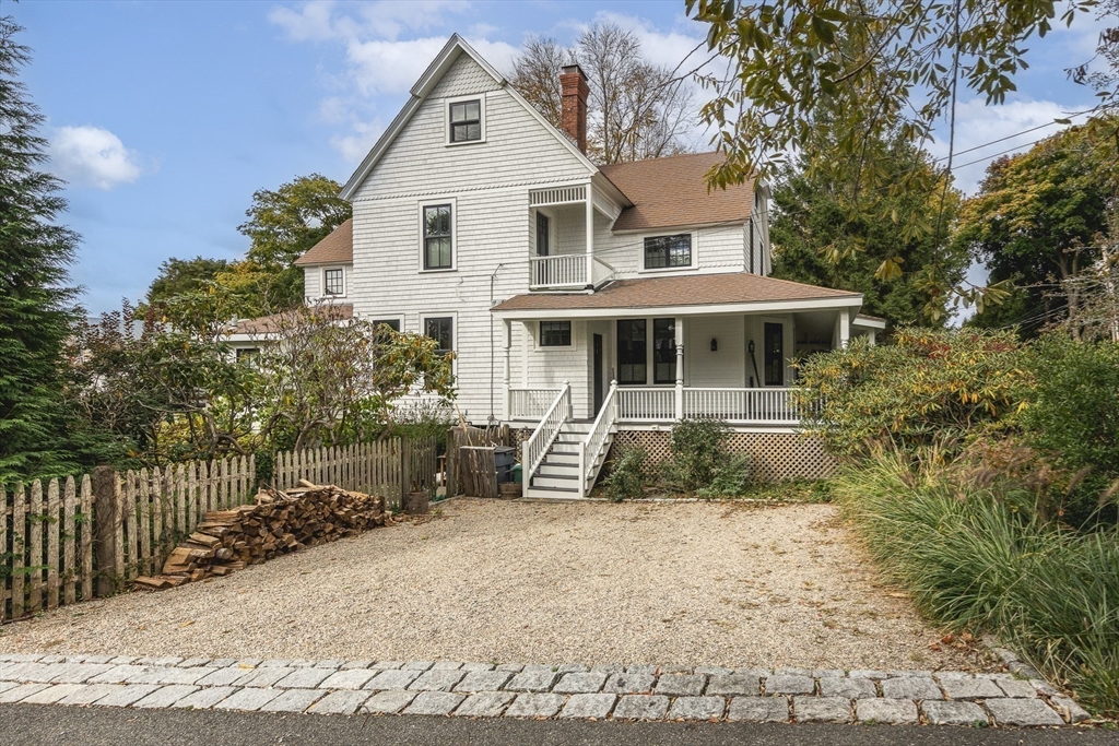 4 Ballast Lane Marblehead, MA 01945 - Photo 2 of 42 a front view of a house with a yard