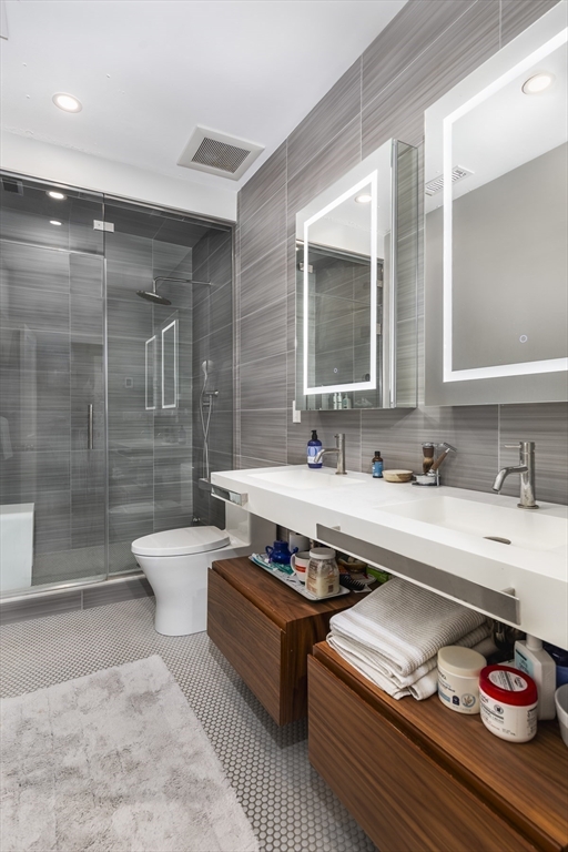 4 Ballast Lane Marblehead, MA 01945 - Photo 23 of 42 a bathroom with a sink double vanity and toilet