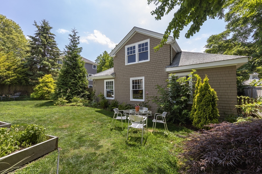 4 Ballast Lane Marblehead, MA 01945 - Photo 35 of 42 a backyard of a house with outdoor seating and green space