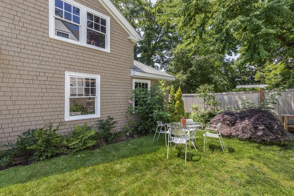 4 Ballast Lane Marblehead, MA 01945 - Photo 36 of 42 a garden with a bench and some plants