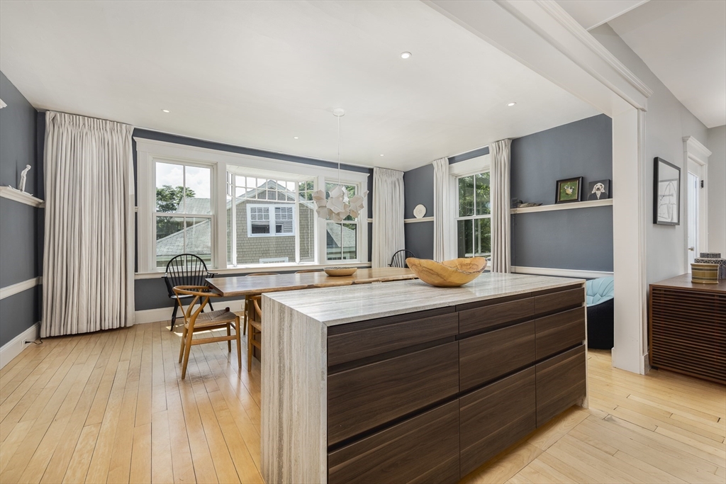 4 Ballast Lane Marblehead, MA 01945 - Photo 8 of 42 a kitchen with stainless steel appliances granite countertop a stove and a wooden floors