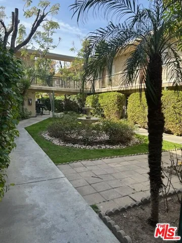 a front view of a house with a yard and a garage